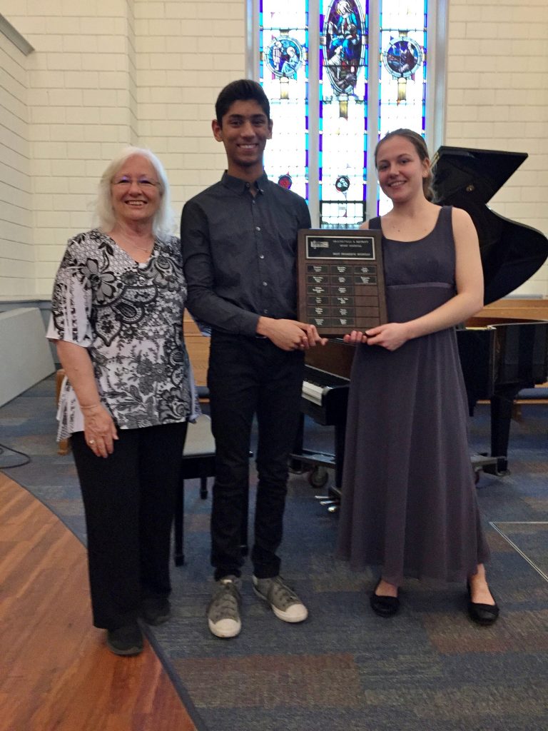 Young man receiving an award for playing music at ODMF